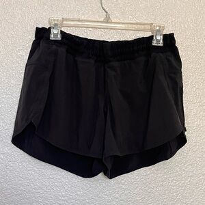 Lululemon size 12 super stretchy waist band black shorts side zipper pocket